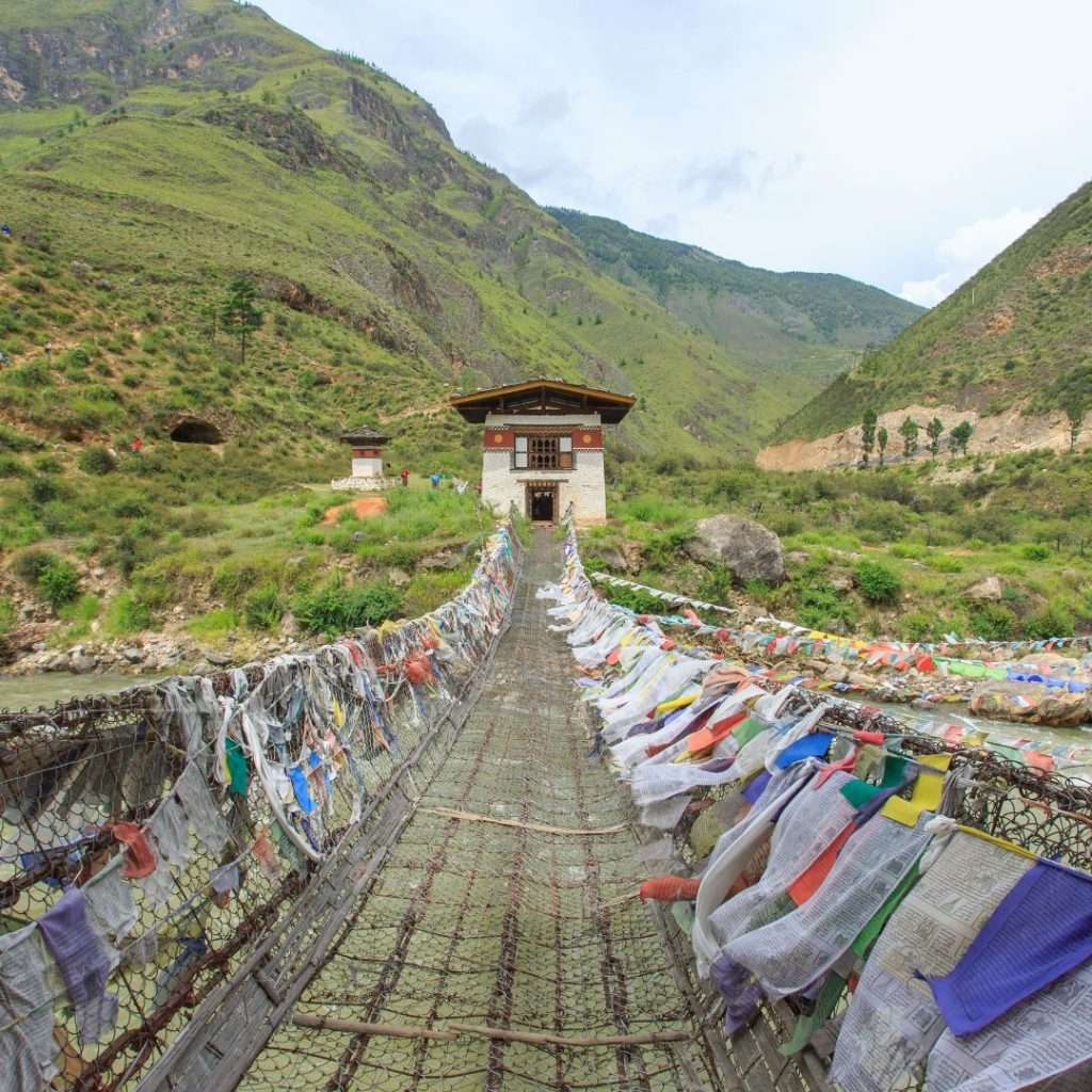 Bhutan hanging bridge with flags